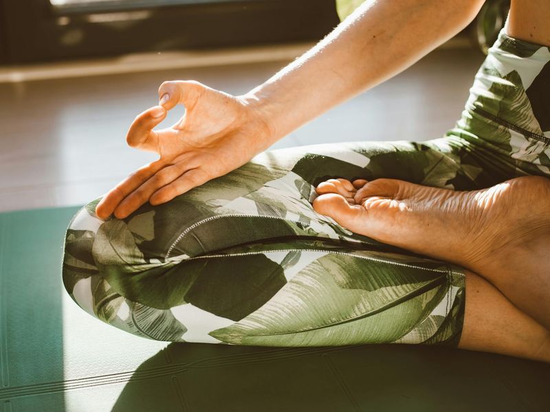 Close up of hands during a yoga flow session.